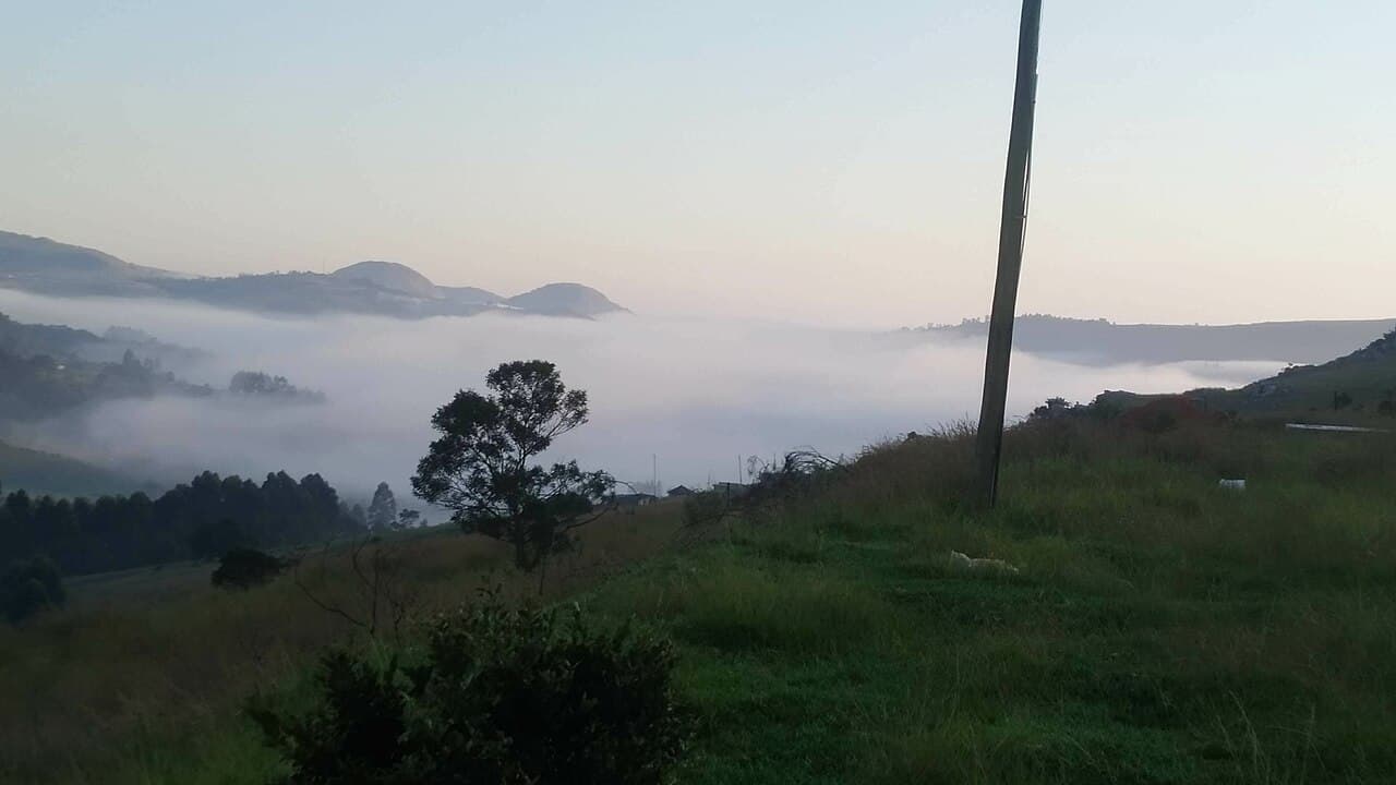 Grønne åser og sletter sett fra en fjellside i Eswatini